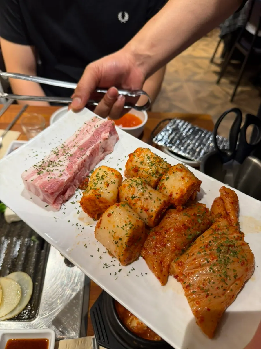 Thick-cut raw pork belly on the grill