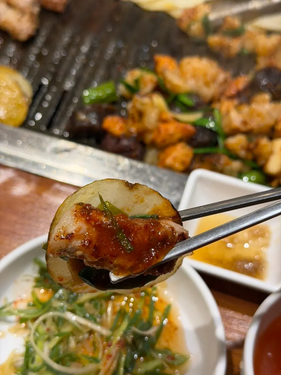 Grilled potato topped with myeong-i namul and basil for a potato wrap