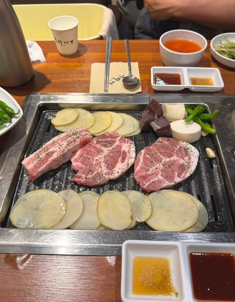 Thick cuts of raw pork served on a plate