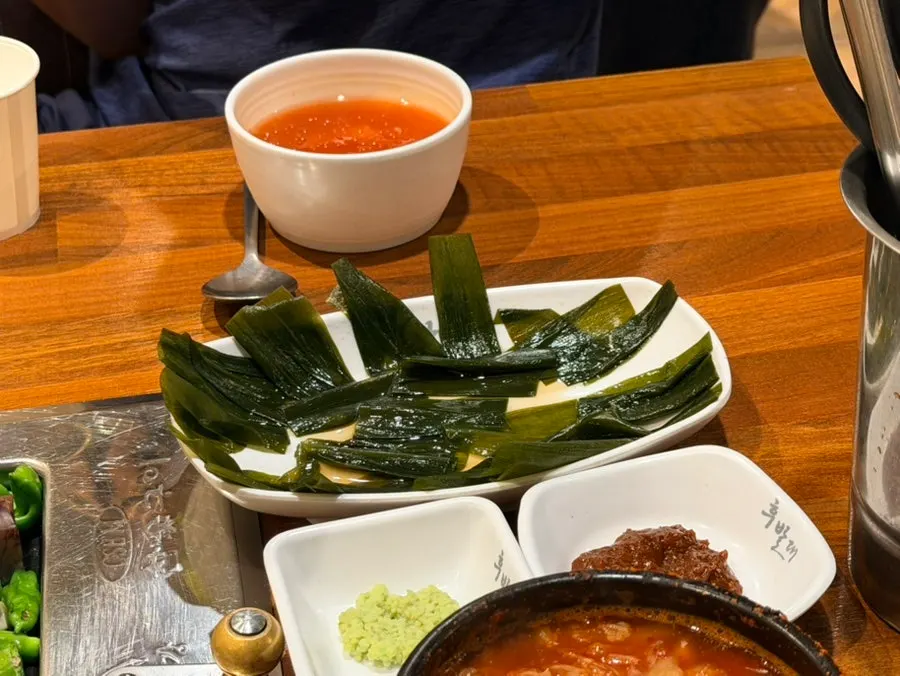 Pork belly and side dishes on the Hubaldae grill