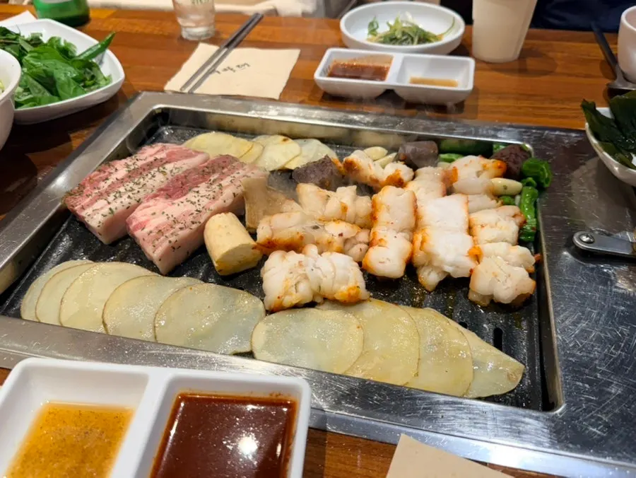 Pork belly grilling to the right doneness under staff supervision