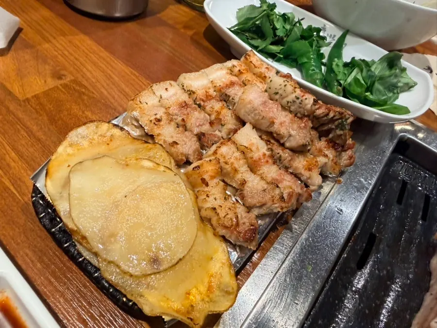 Finished bite-sized pork belly, potato, and basil wrap