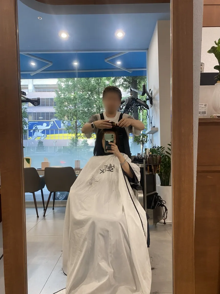 Mid-length hair with a smooth, even texture after the clinic