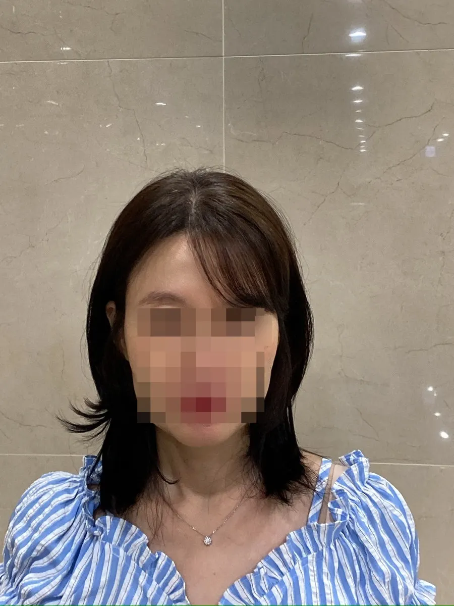 Mid-length hair fully styled after the clinic
