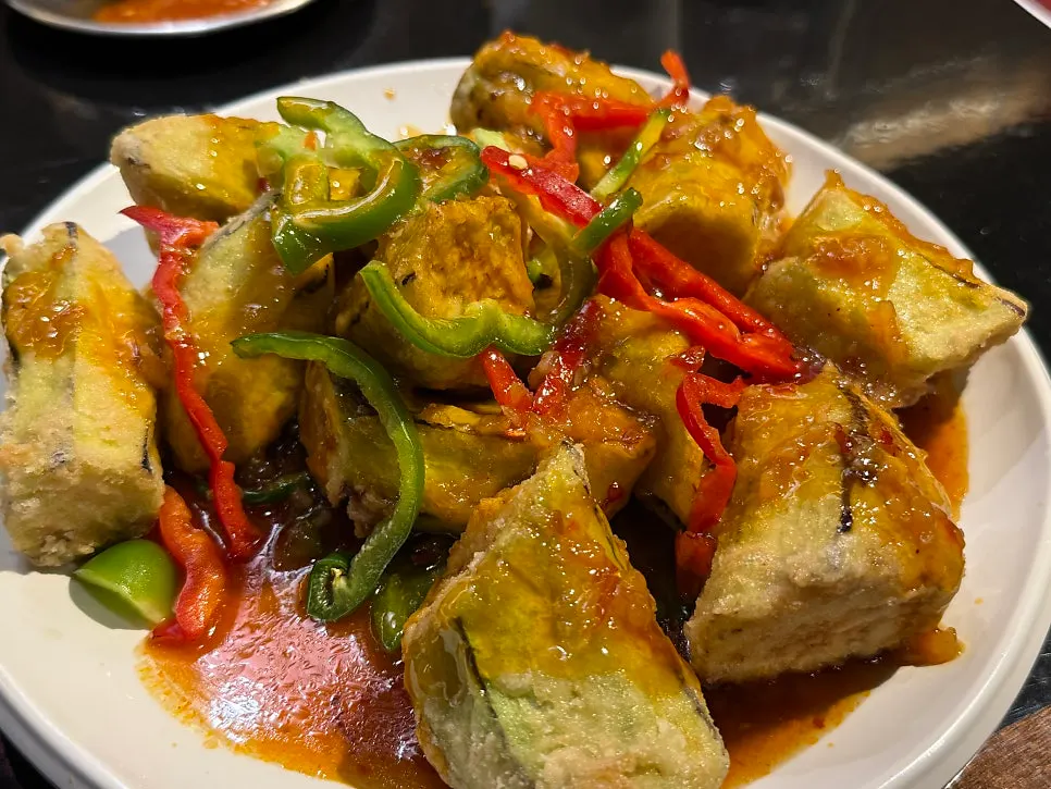 Fried eggplant served with chili sauce