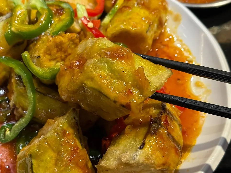 Cross-section of fried eggplant showing thin batter