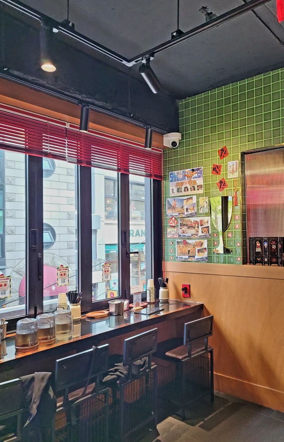 Huhugwan's interior with red lighting and colorful tiles