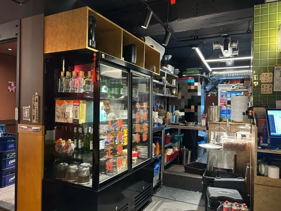 Interior seating and kitchen view at Huhugwan