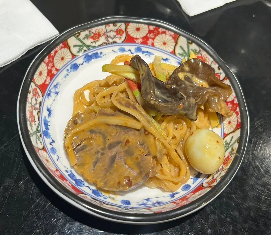 Mazangmyeon mixed with braised beef shank on top