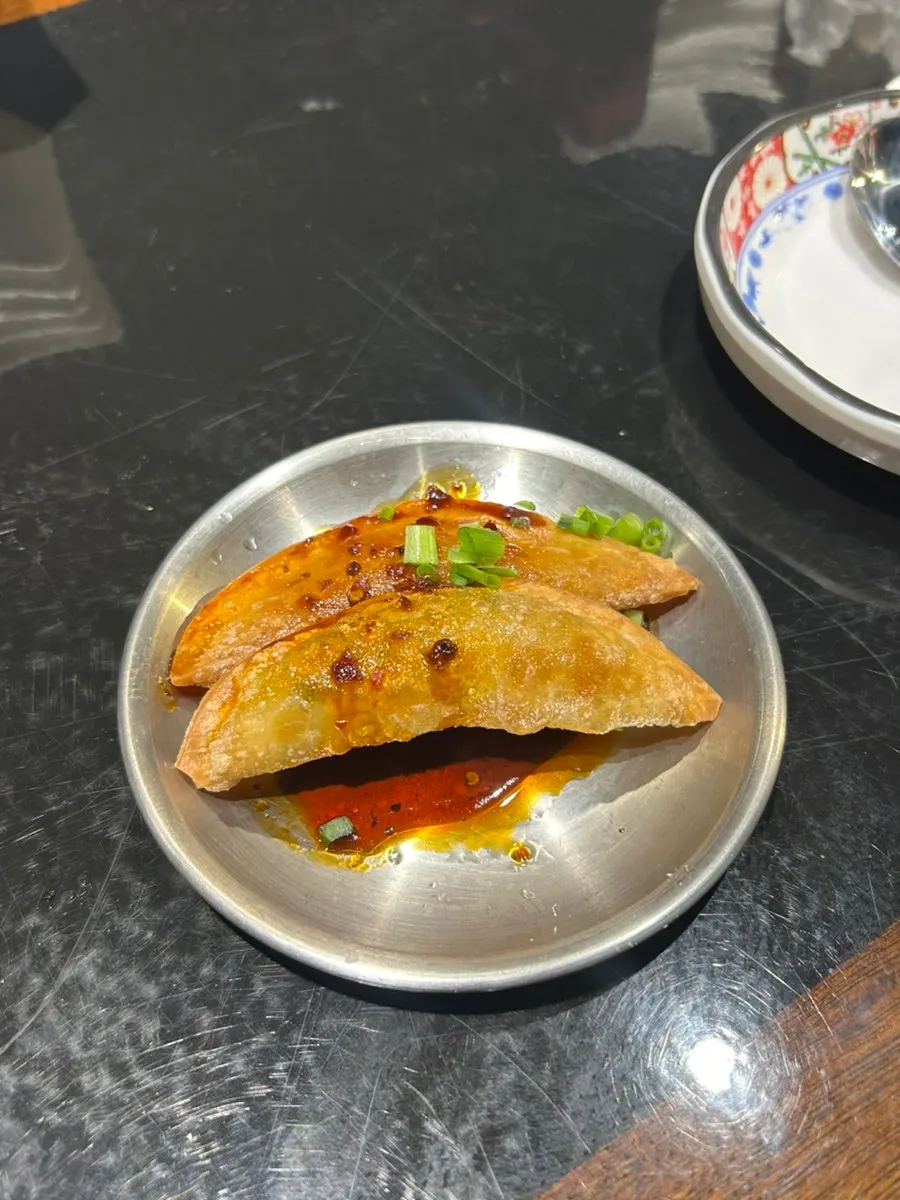 Fried eggplant served alongside fried rice