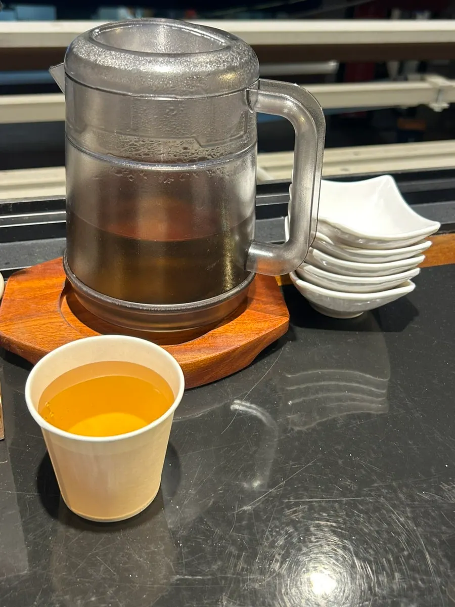 Complimentary peanuts and tea served as a side