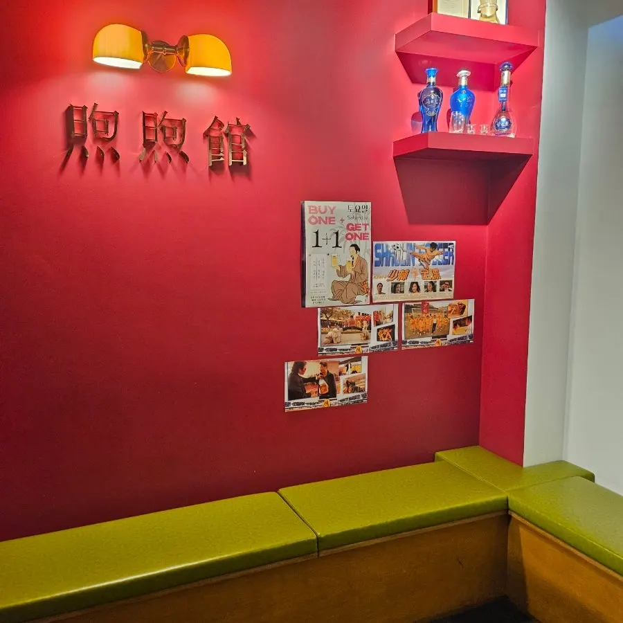 Chinese restaurant poster on the wall beside the staircase