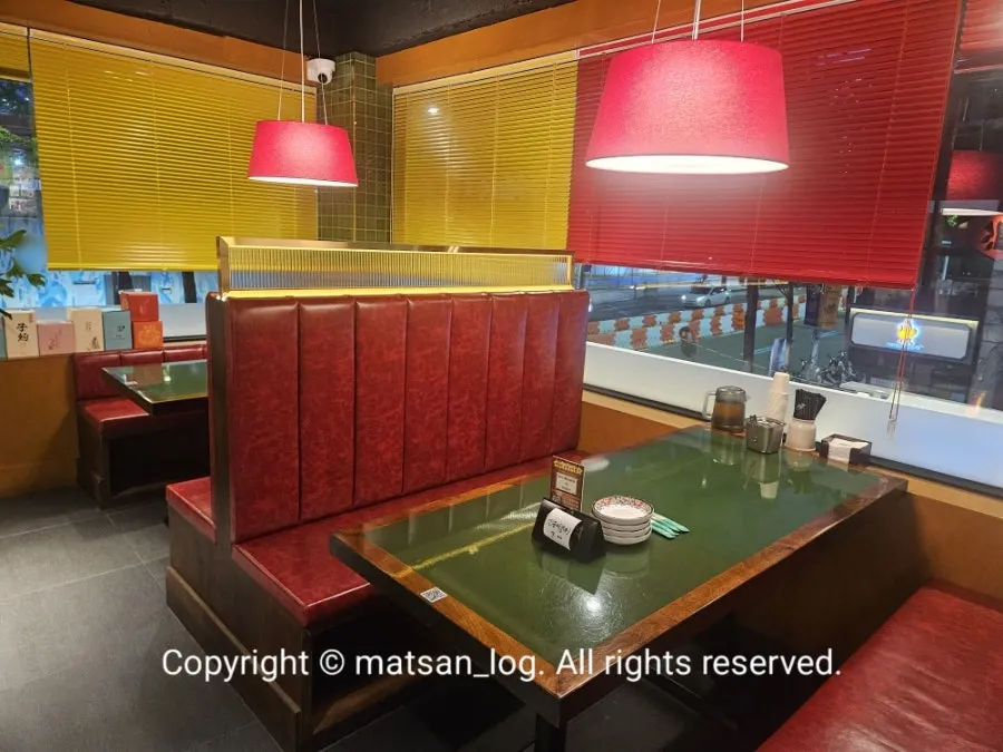 Huhugwan dining hall with yellow blinds and red lighting
