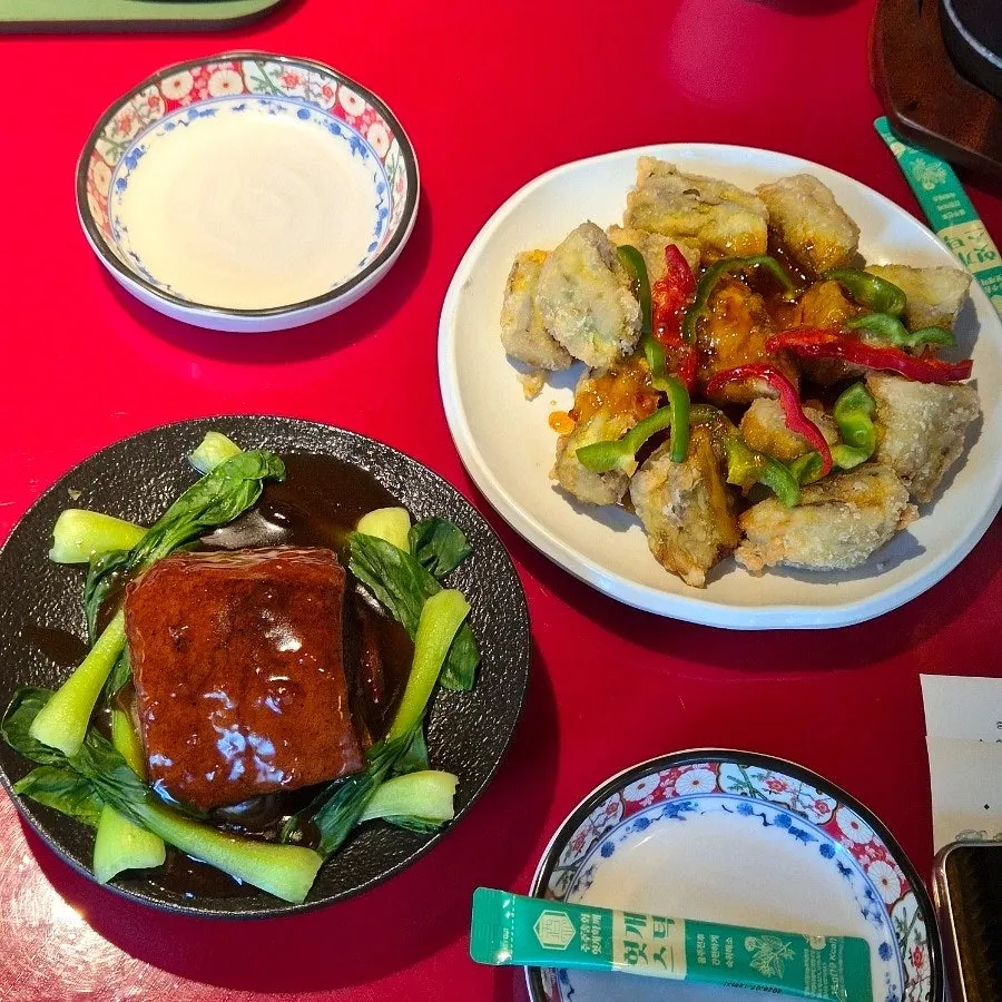Full spread of eggplant fritters and braised pork belly