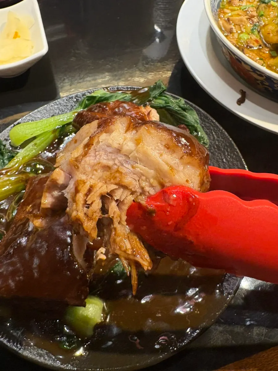 Huhugwan's braised pork belly served with bok choy