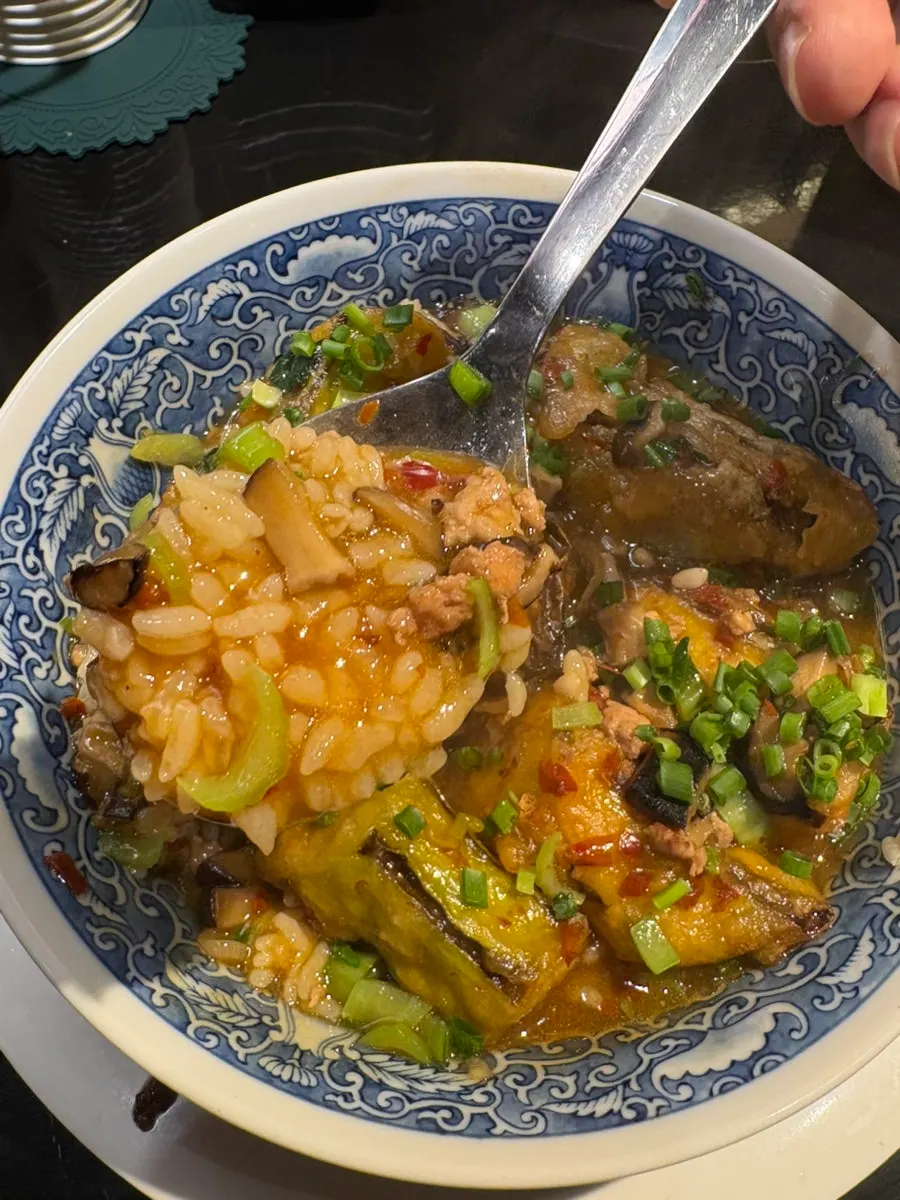 A spoonful of Huhugwan's eggplant rice bowl