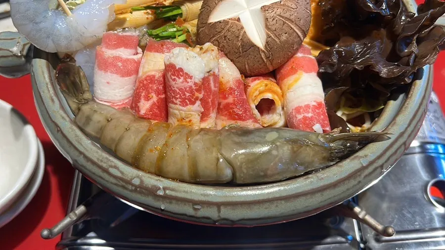 Close-up of skewered ingredients before boiling in the mala hot pot