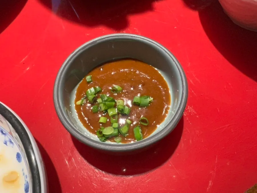 Peanut-based dipping sauce served with the mala hot pot