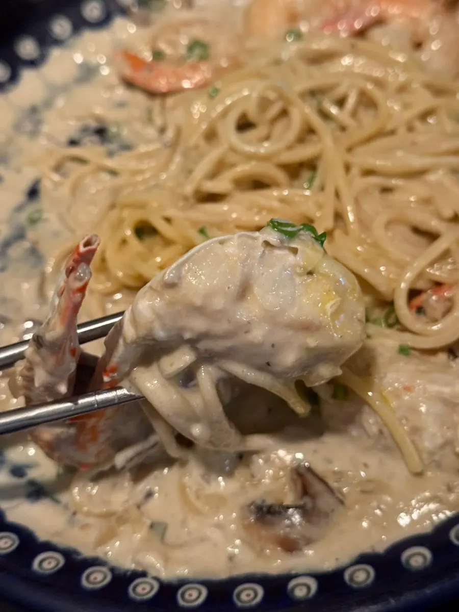 Noodles coated in the kanimiso pasta sauce
