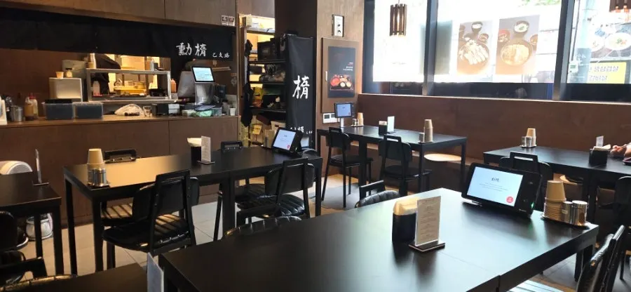 Waitlist and meal log signage at the entrance of Hunta Euljiro