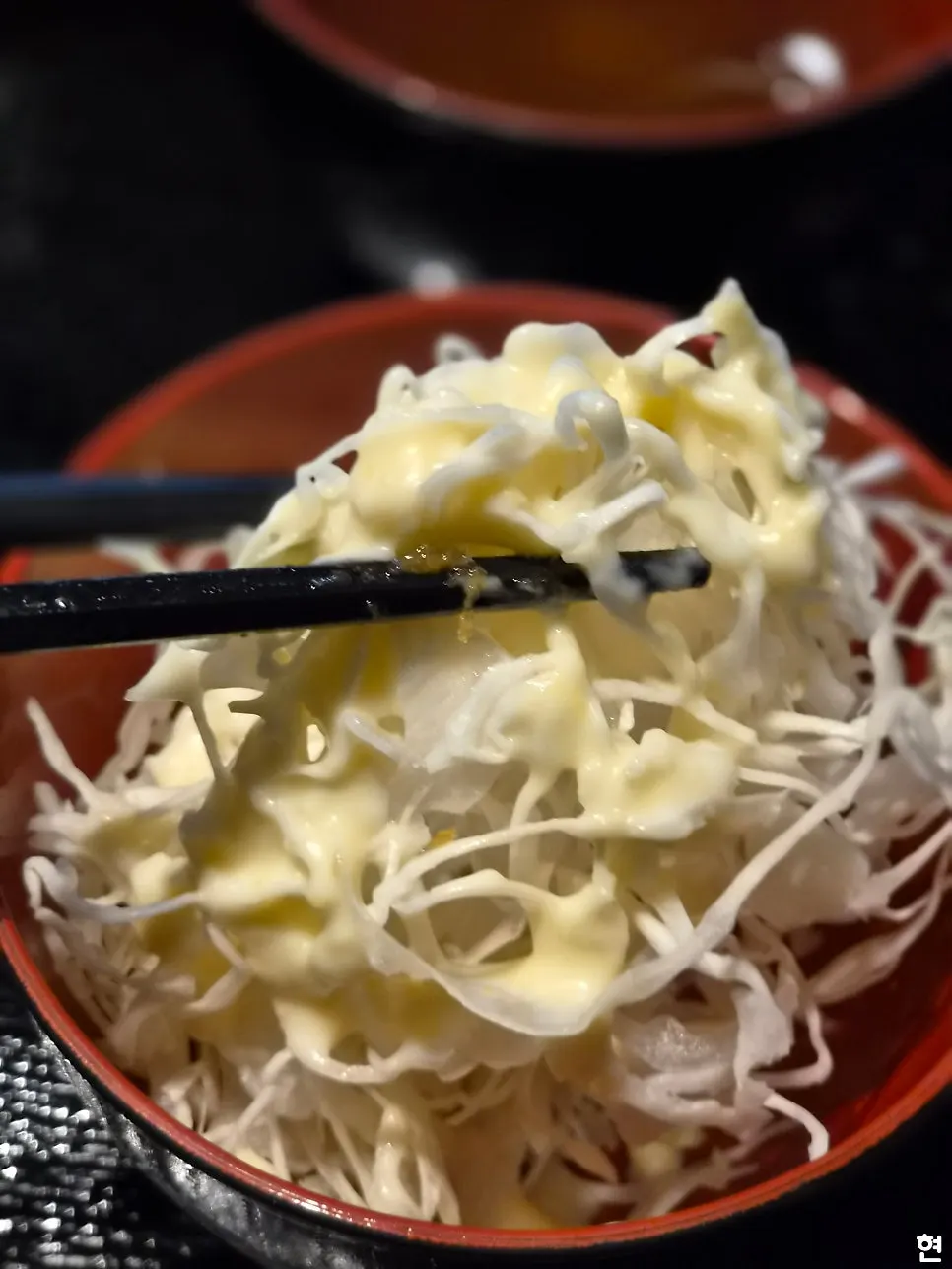 Cabbage salad topped with dressing