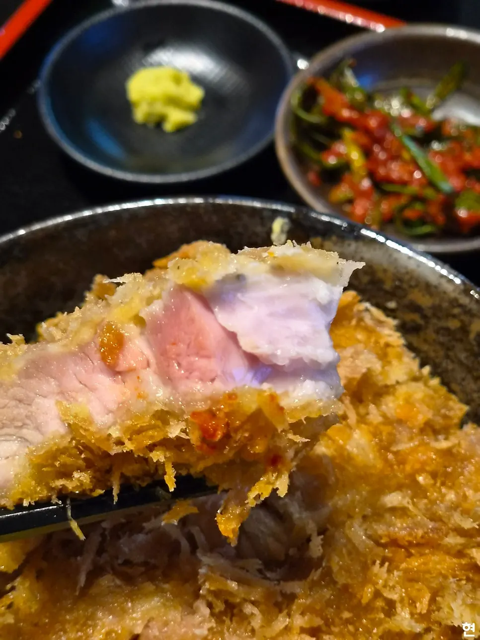 Katsudon served with scallion kimchi on the side