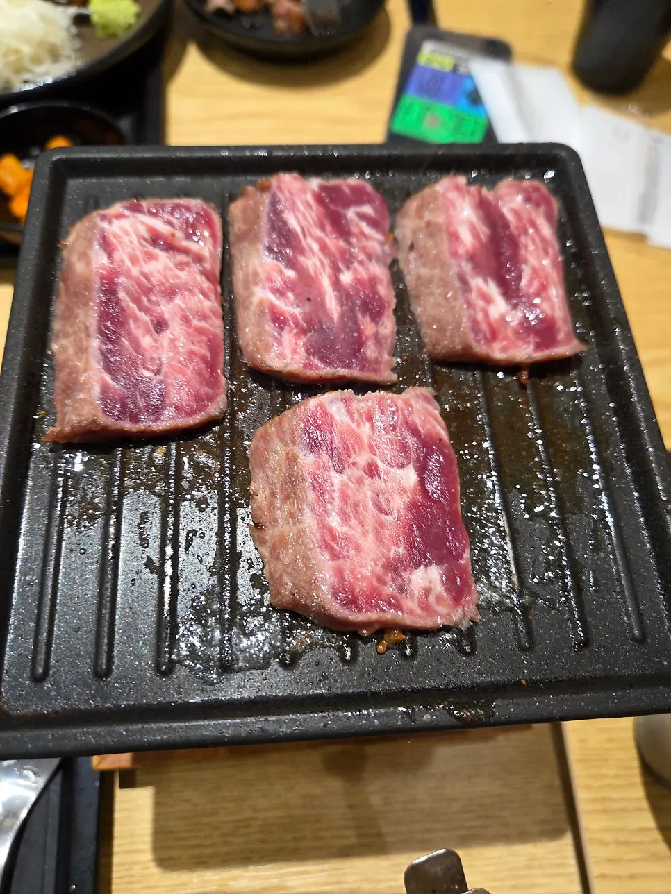 Steki being grilled on the tabletop grill
