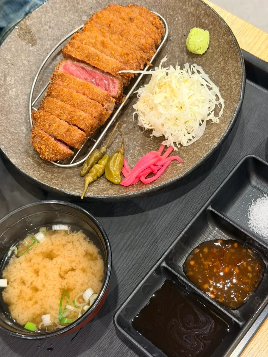Soy sauce, salt, chili sauce and wasabi served alongside