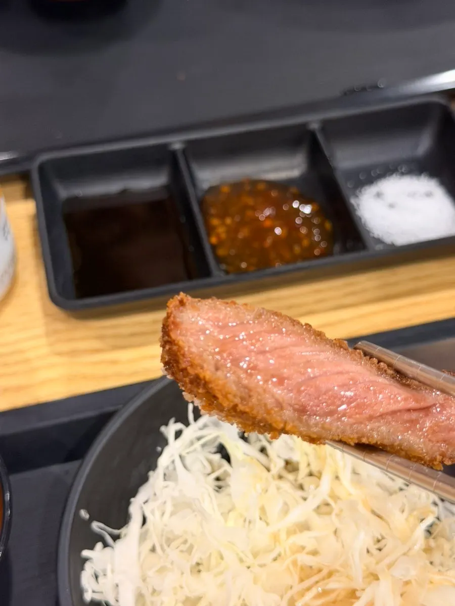 A piece of gyukatsu grilled to medium-rare