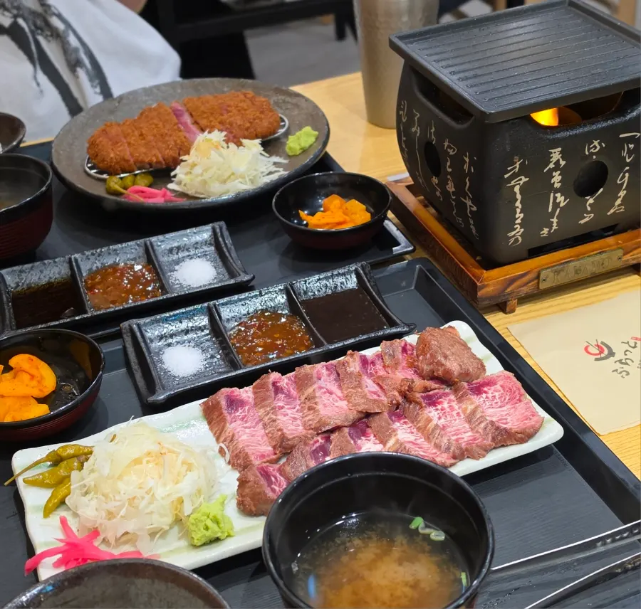 Table with both gyukatsu and steki set menu laid out