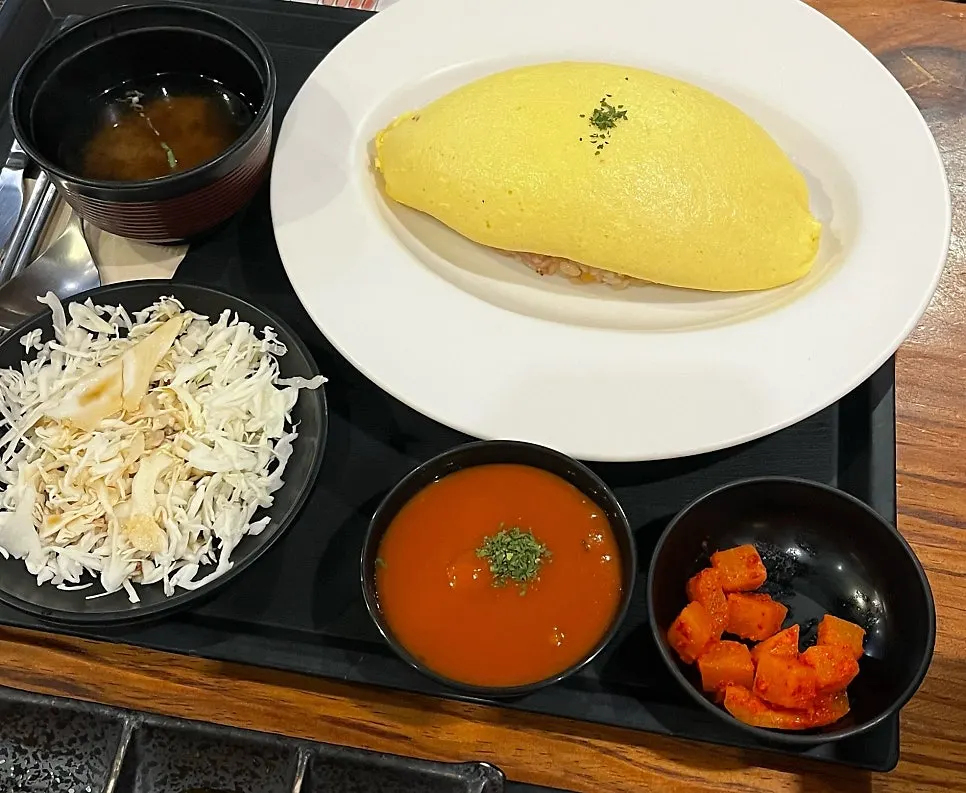 Japanese-style omurice with diced radish kimchi and pickled radish side dishes