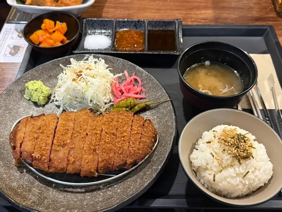 Grilled gyukatsu served with dipping sauce and wasabi