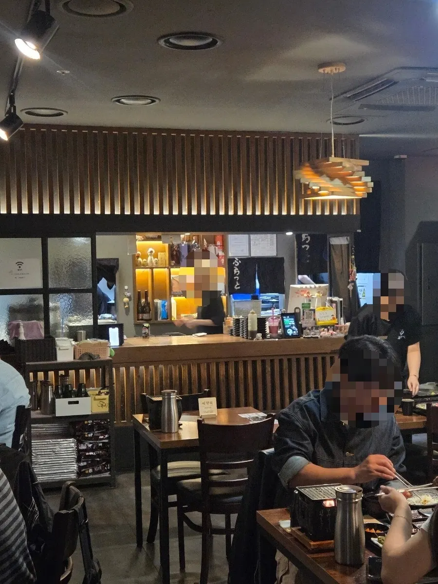 Interior with wood-toned tables and soft lighting