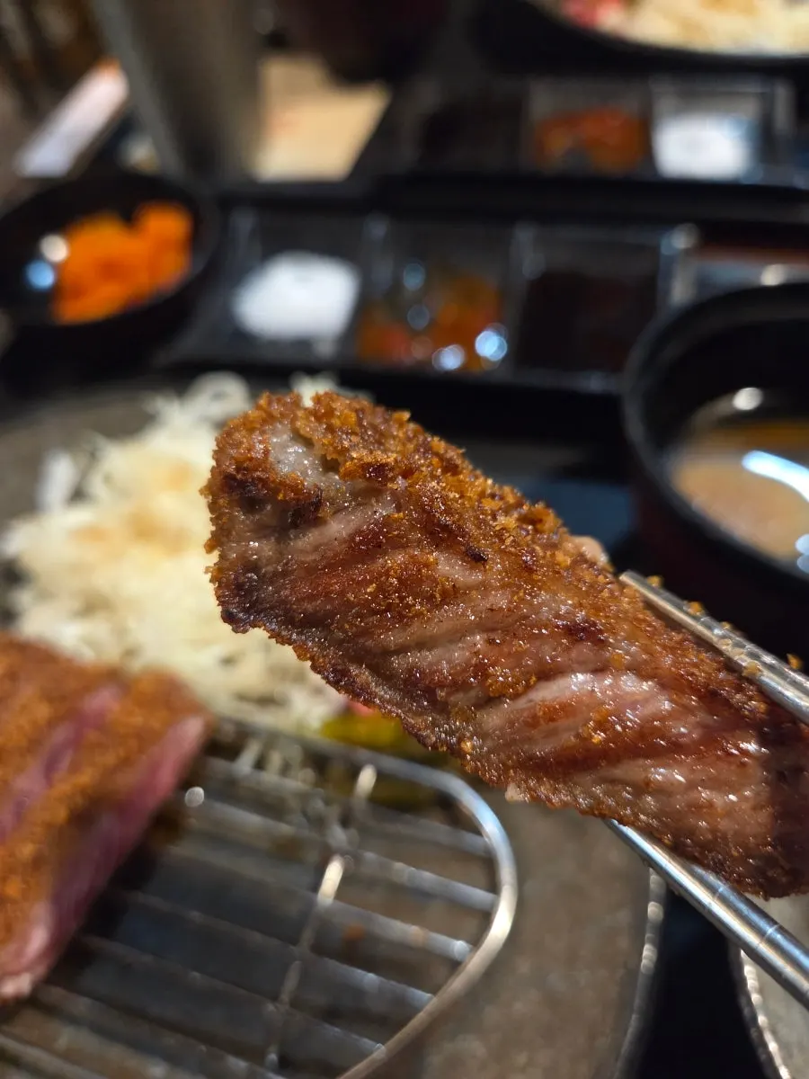 Plate of gyukatsu served together with cabbage