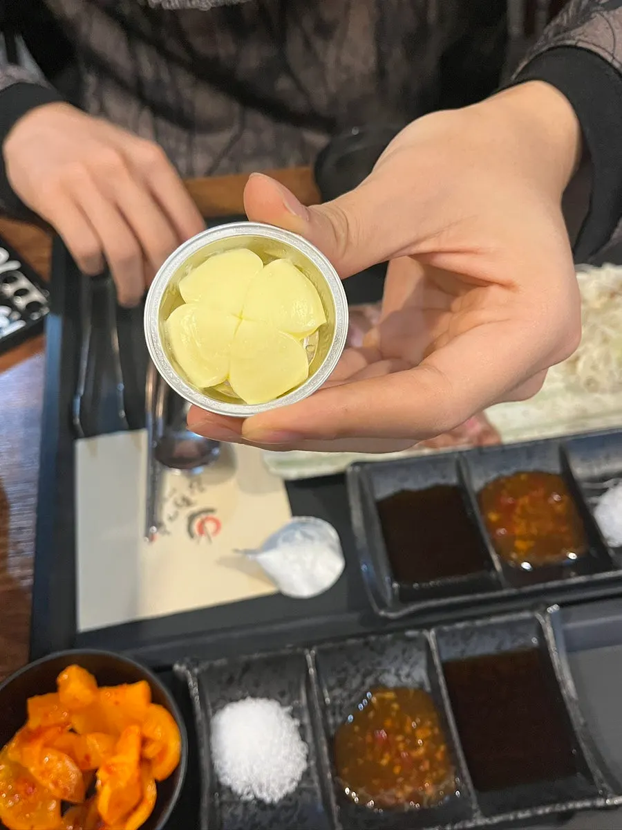 Salt, chili, and soy sauces with fresh wasabi