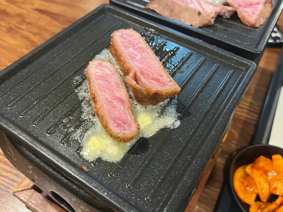 A piece of gyukatsu cooked to the desired doneness