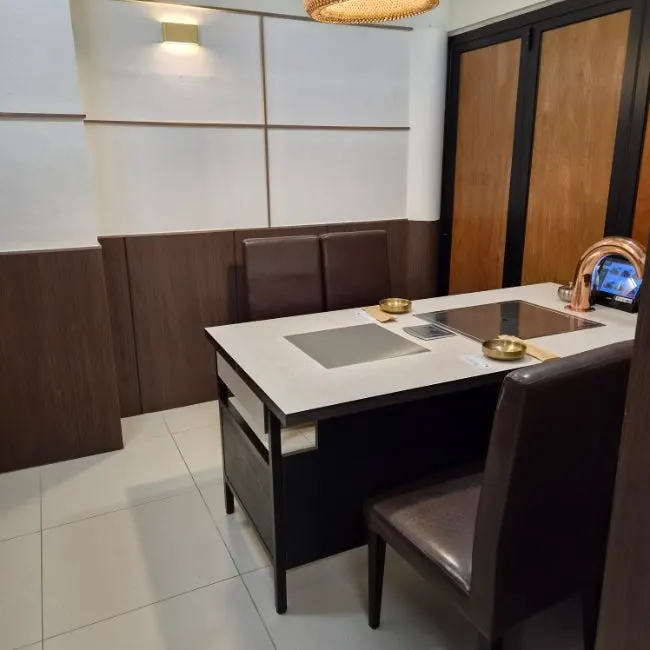 Interior seating and room atmosphere at Hwadamga