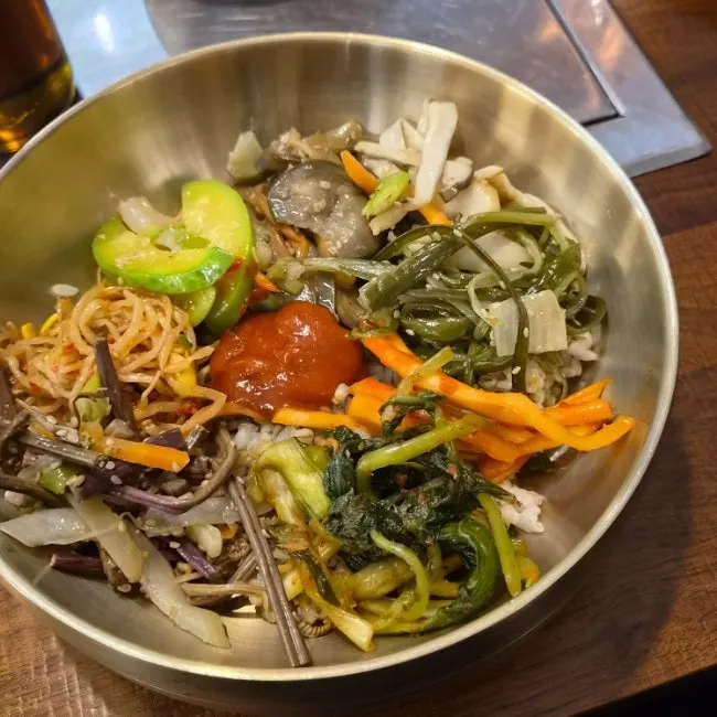 Sesame oil and gochujang set out on the table