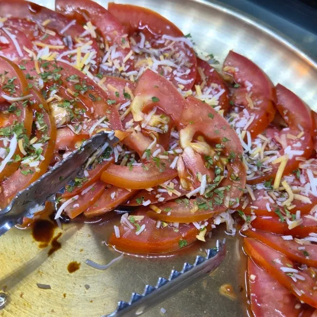 Salad served with chili peppers and garlic