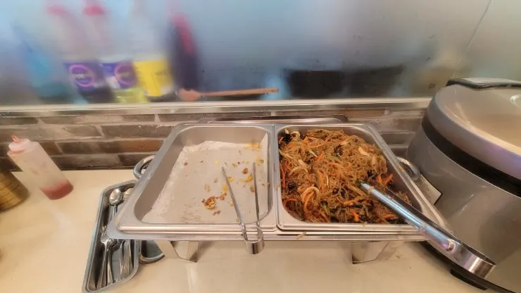 Japchae and seaweed soup kept warm in a rice cooker