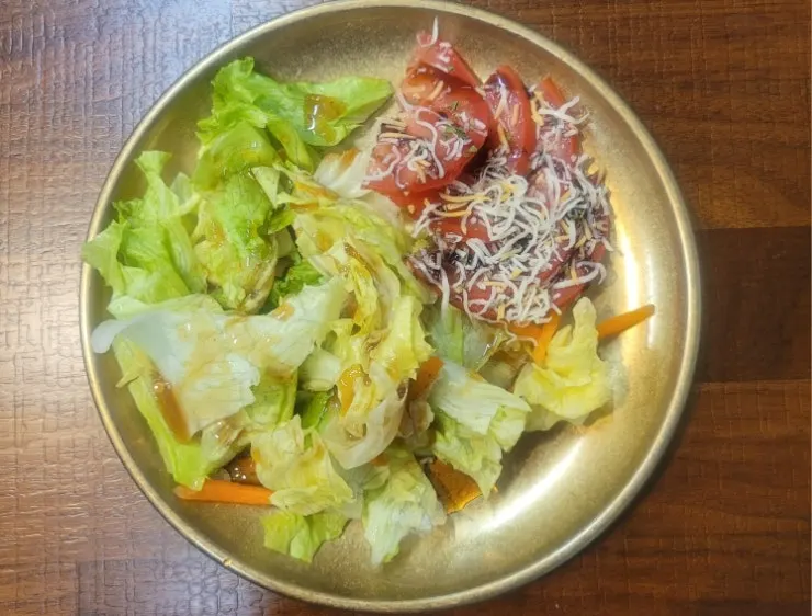 Seaweed soup and side dishes scooped into brass bowls