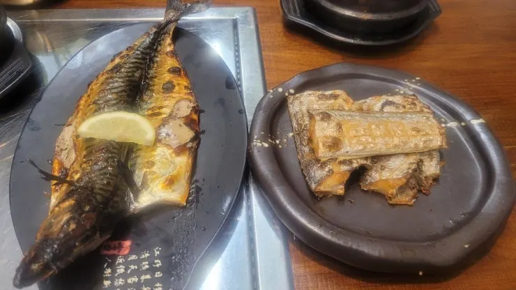 Grilled fish spread served on a cast-iron-look plate