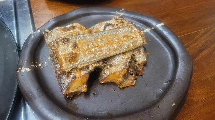 Golden-brown grilled mackerel