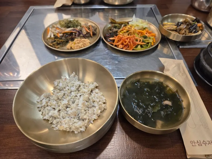 Basic table setting of rice, seaweed soup, and doenjang jjigae