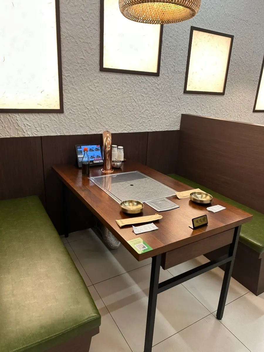 Spacious interior and tables at Hwadamga