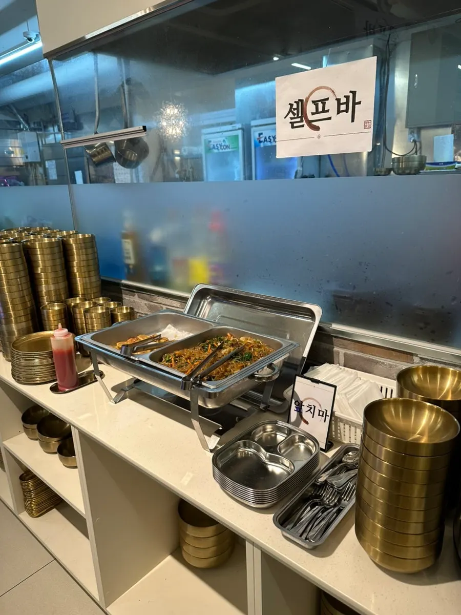 Full table spread with grilled mackerel and set dishes