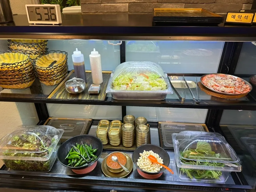Self-serve corner with wrap vegetables and salad