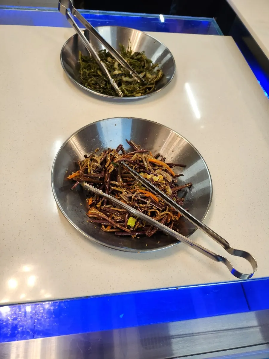 Side dishes set out at Hwadamga's self-serve bar