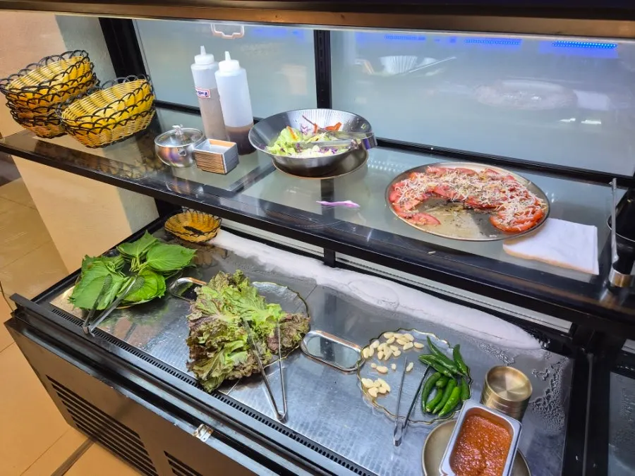 Self-serve corner with omija and mango drinks