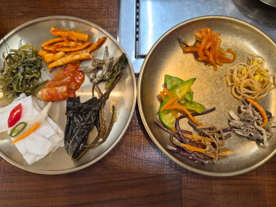A spread of side dishes brought from the self-serve bar